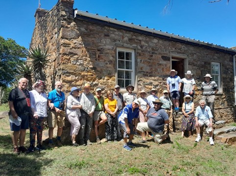 SAMHSEC members and guests gather outside St Mary’s Church Cuylerville. Adele Cutten (4th from left) described the settlement’s fascinating history.  (Photo: Sue Gordon)