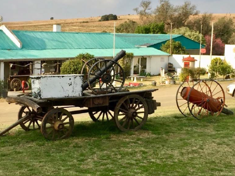 The sea-green roofed hotel (Building 4) with old fire-fighting equipment in the foreground (Photo: Sue Gordon)